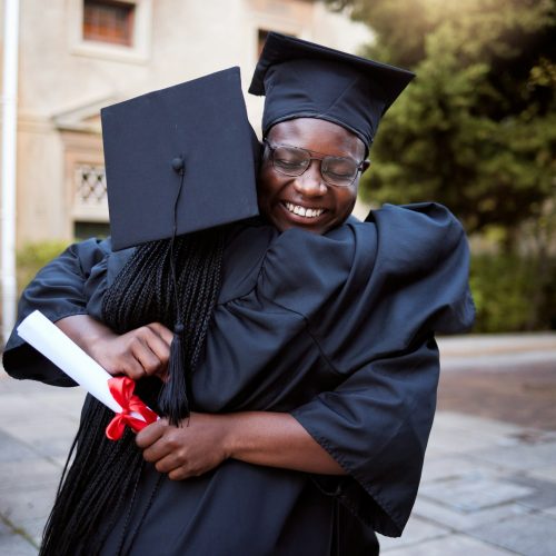 Black people, hug and celebration in graduation ceremony, university degree success or school diplo Black people, hug and celebration in graduation ceremony, university degree success or school diplo